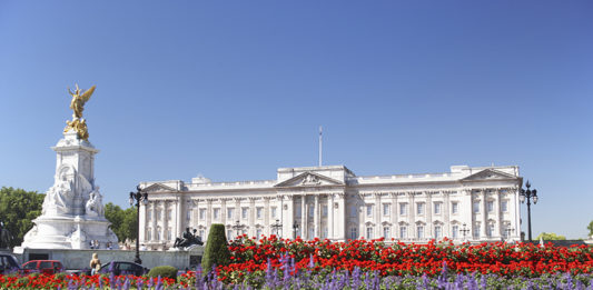 Buckingham Palace With Flowers Blooming In The Queen's Garden, London, England. Credit: Shutterstock