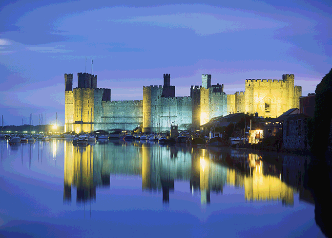 Caernarfon Castle, Gwynedd, north Wales. Credit: David Angel/Alamy