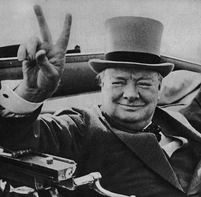 Churchill flashes his famous V for victory sign. Credit: David Cole/Alamy