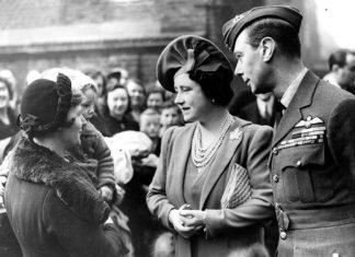 King George VI and Queen Elizabeth visit families at Peckham Central School Community Centre