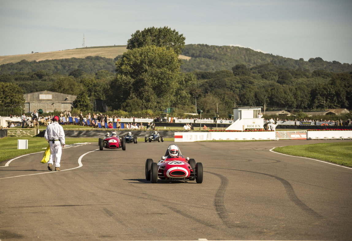 Vintage racing car on the racetrack at Goodwood Revival festival, Goodwood, England. Credit: Visit Britain