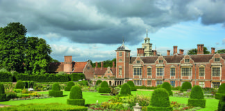 The Parterre Garden at Blickling Estate, Norfolk. Blickling is a turreted red-brick Jacobean mansion, sitting within beautiful gardens and parkland.