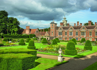 The Parterre Garden at Blickling Estate, Norfolk. Blickling is a turreted red-brick Jacobean mansion, sitting within beautiful gardens and parkland.