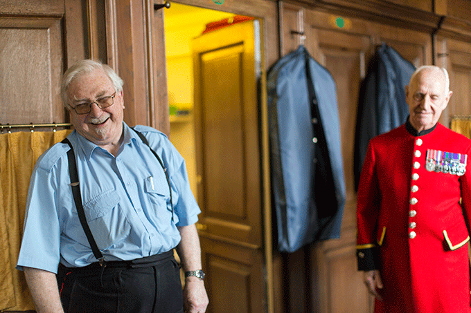 Two Chelsea Pensioners share a joke. Christopher Wren Long Wards, Royal Chelsea Hospital. Credit: Stephen Bennett