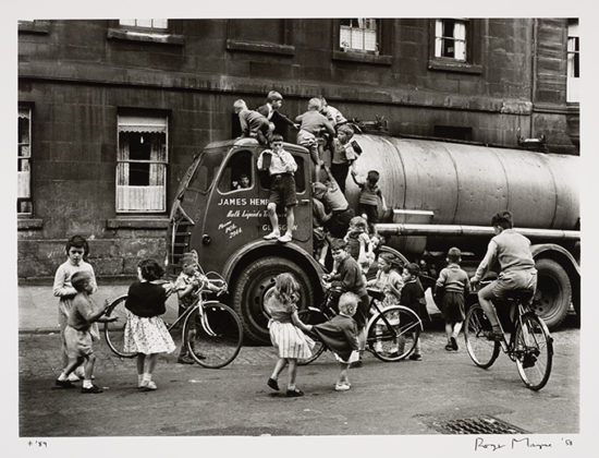 Children playing on a lorry, Glasgow, 1958, by Roger Mayne. When We Were Young exhibition at the National Galleries of Scotland
