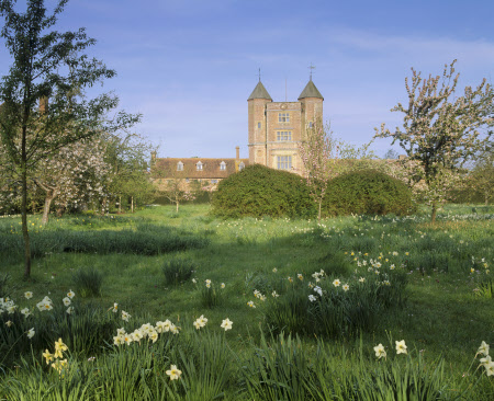 Part of the orchard at Sissinghurst Castle Garden, Kent, created by Vita Sackville-West and her husband, which was developed around surviving parts of an Elizabethan mansion seen in the background