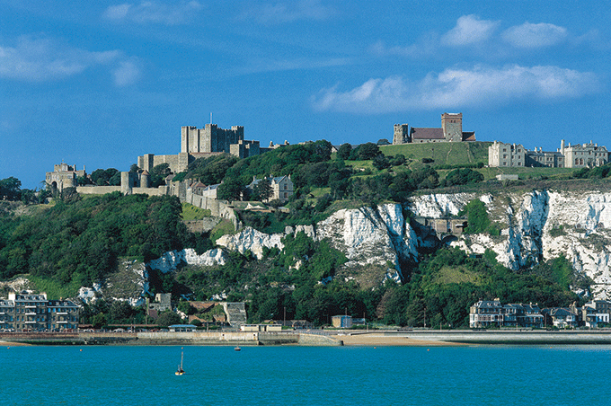 View from the sea of Dover Castle and the famous white cliffs Credit: VisitEngland