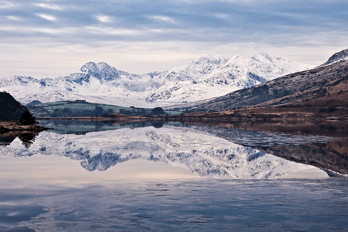 Winter snowfall on the Snowdon Horseshoe and reflected in Llynnau Mymbyr. Credit: Simon Kitchin 